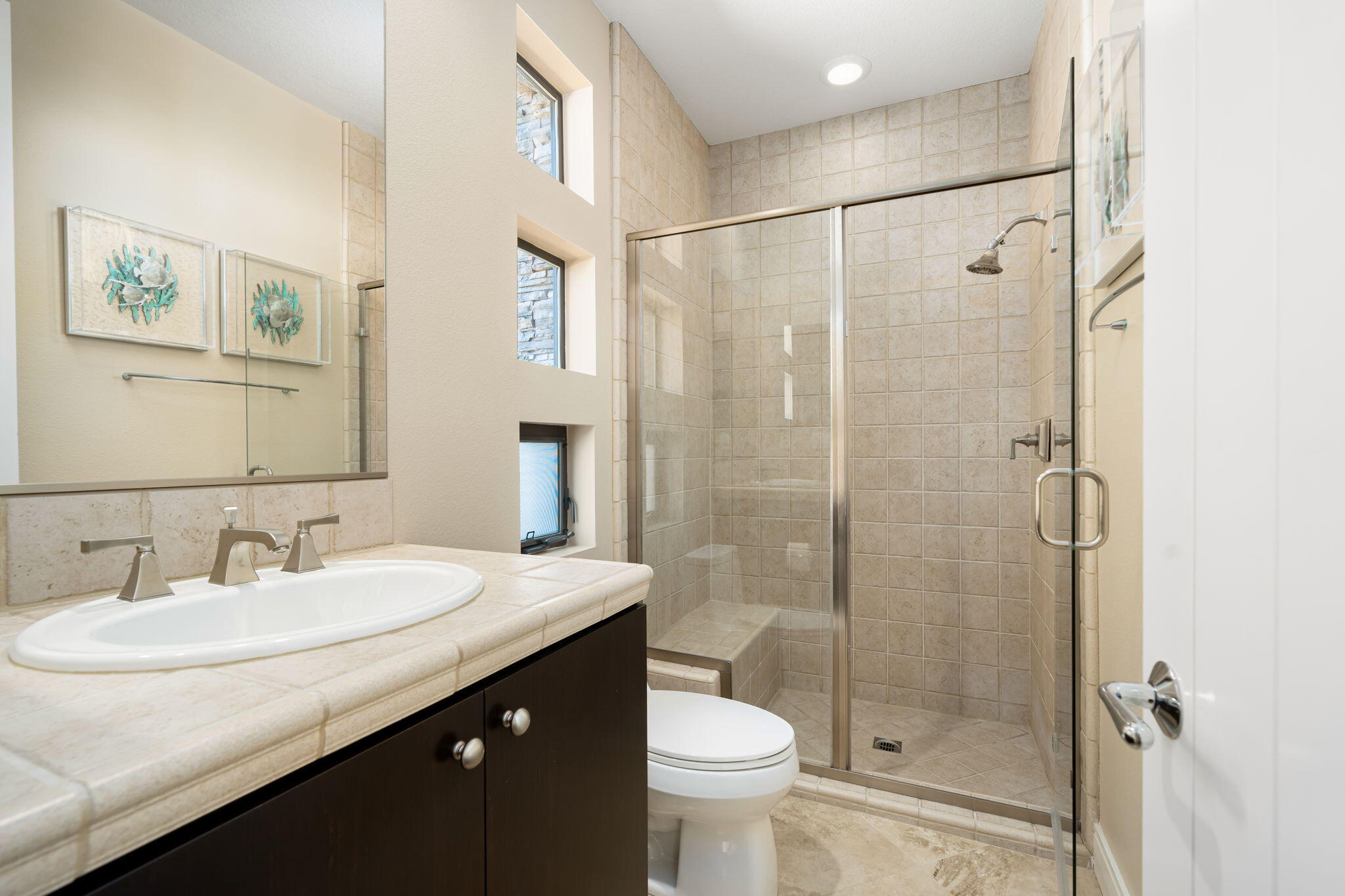 14 Dominion Court Rancho Mirage, CA 92270 - Photo 46 of 65 a bathroom with a sink a toilet and shower