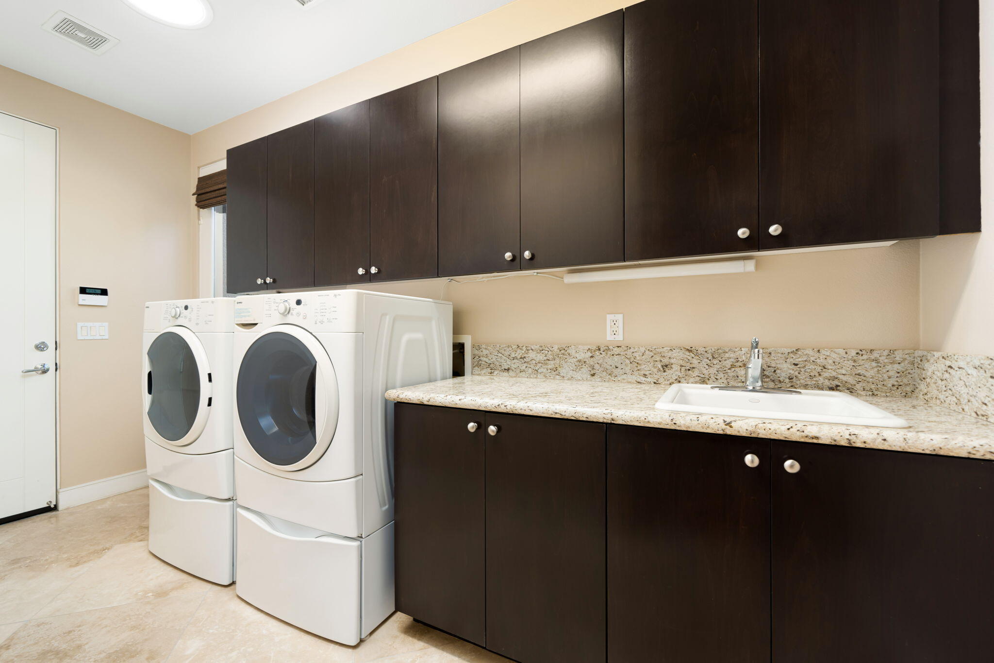14 Dominion Court Rancho Mirage, CA 92270 - Photo 47 of 65 a utility room with dryer and washer