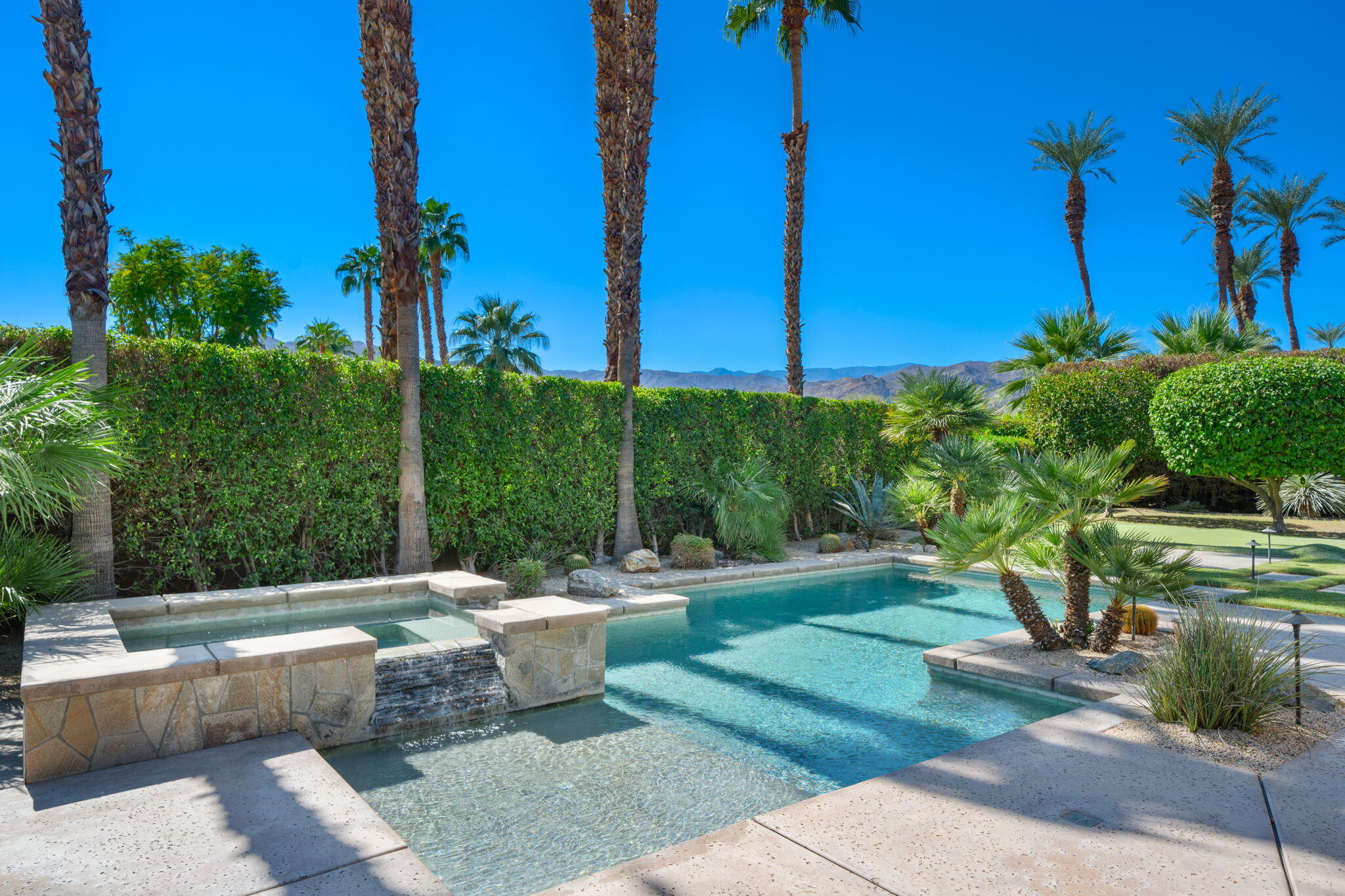 14 Dominion Court Rancho Mirage, CA 92270 - Photo 49 of 65 a view of a swimming pool with a patio