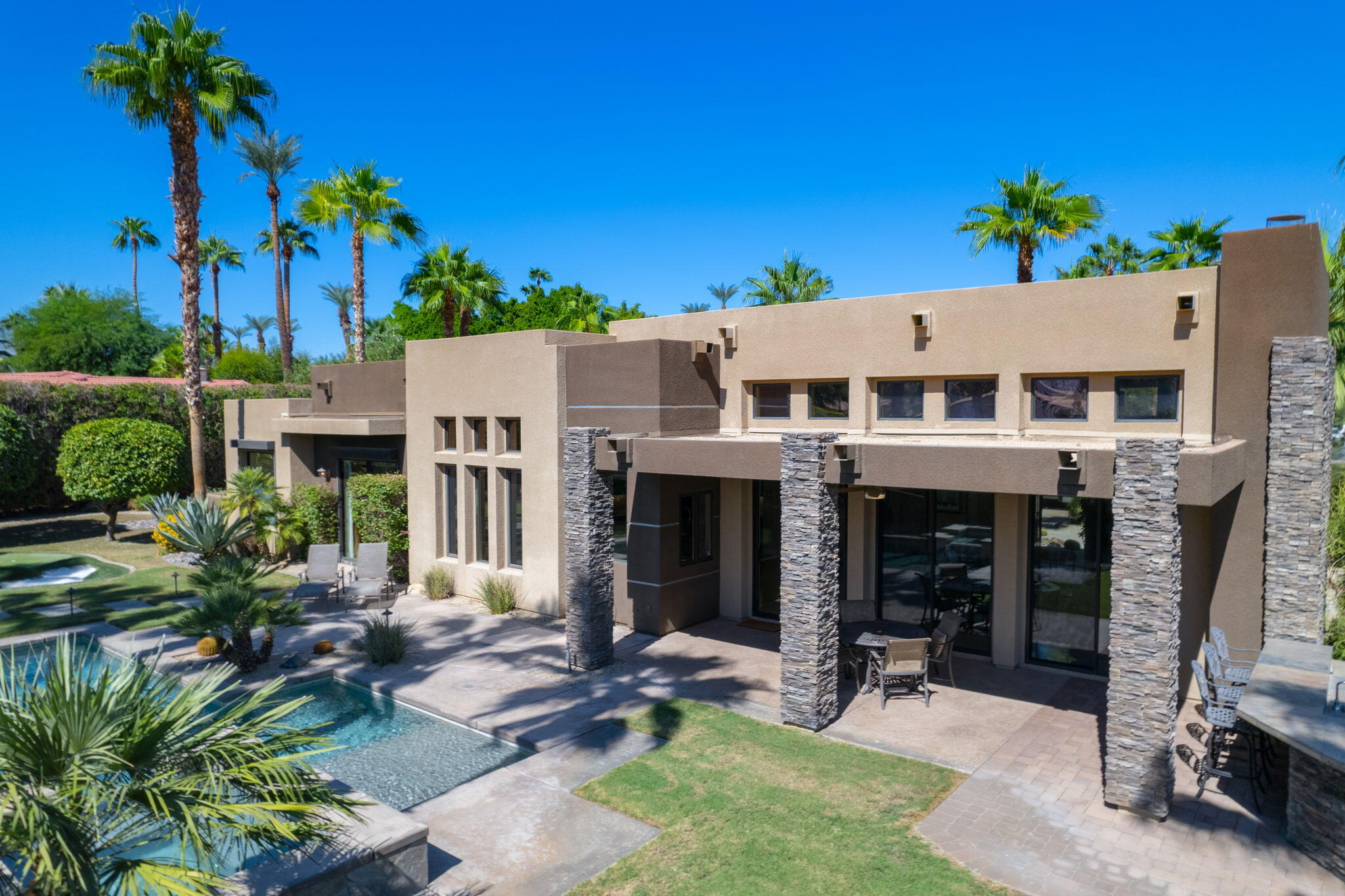 14 Dominion Court Rancho Mirage, CA 92270 - Photo 50 of 65 a view of house with outdoor seating and yard
