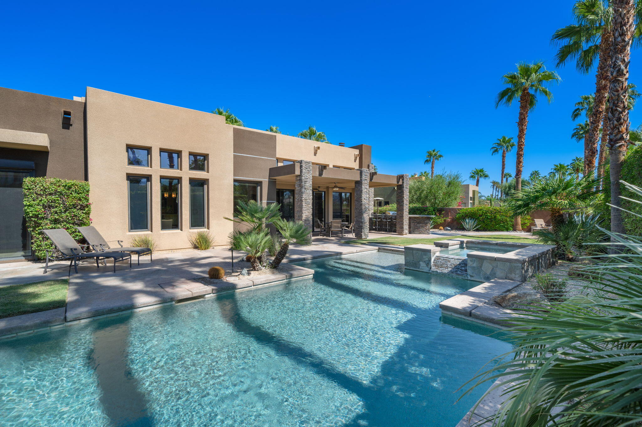 14 Dominion Court Rancho Mirage, CA 92270 - Photo 52 of 65 a view of a house with swimming pool and sitting area
