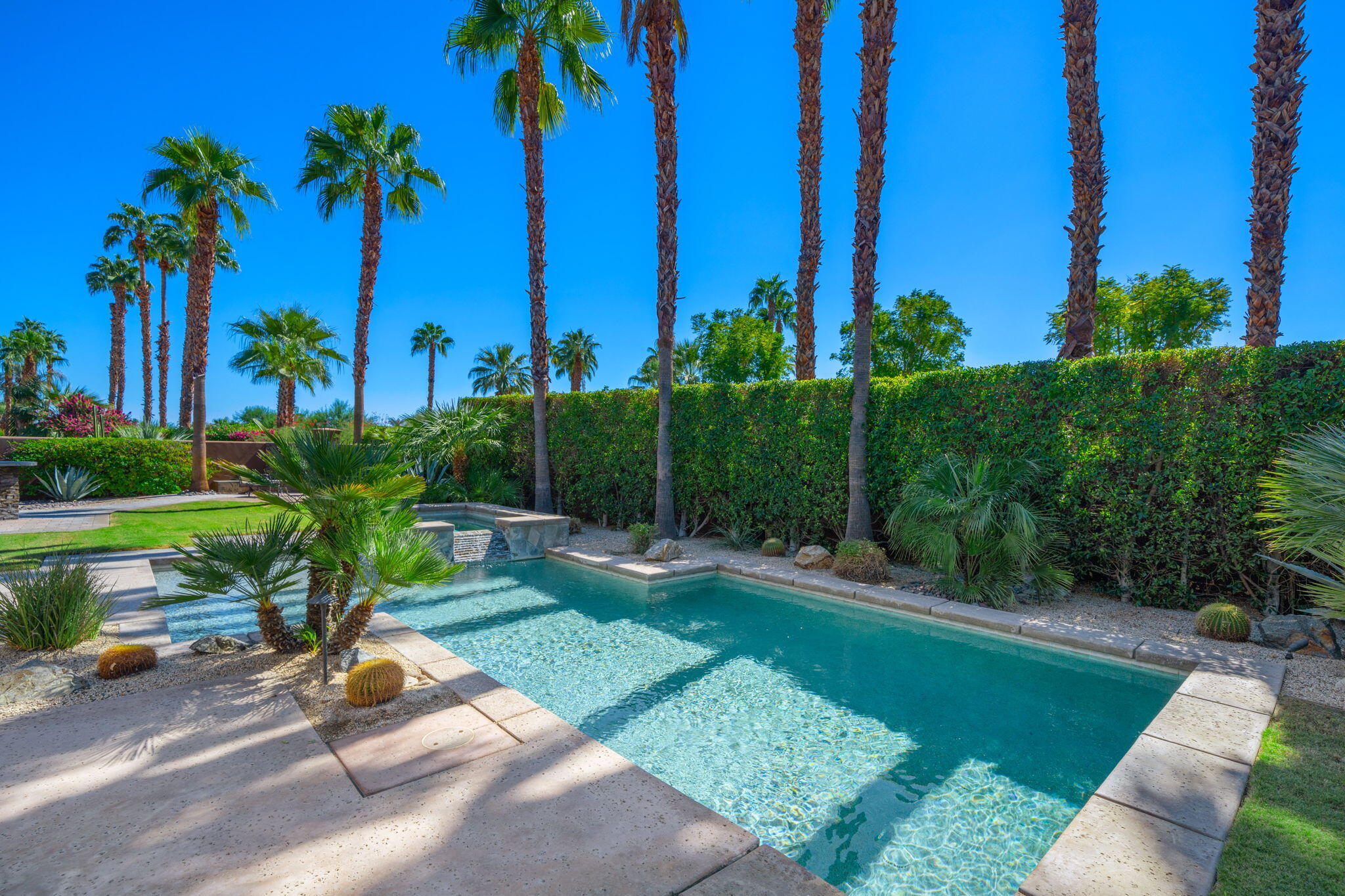 14 Dominion Court Rancho Mirage, CA 92270 - Photo 55 of 65 a view of a backyard with a patio
