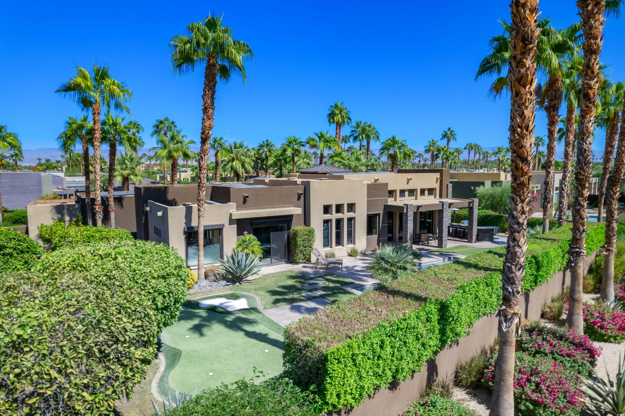 14 Dominion Court Rancho Mirage, CA 92270 - Photo 60 of 65 a view of a house with a garden