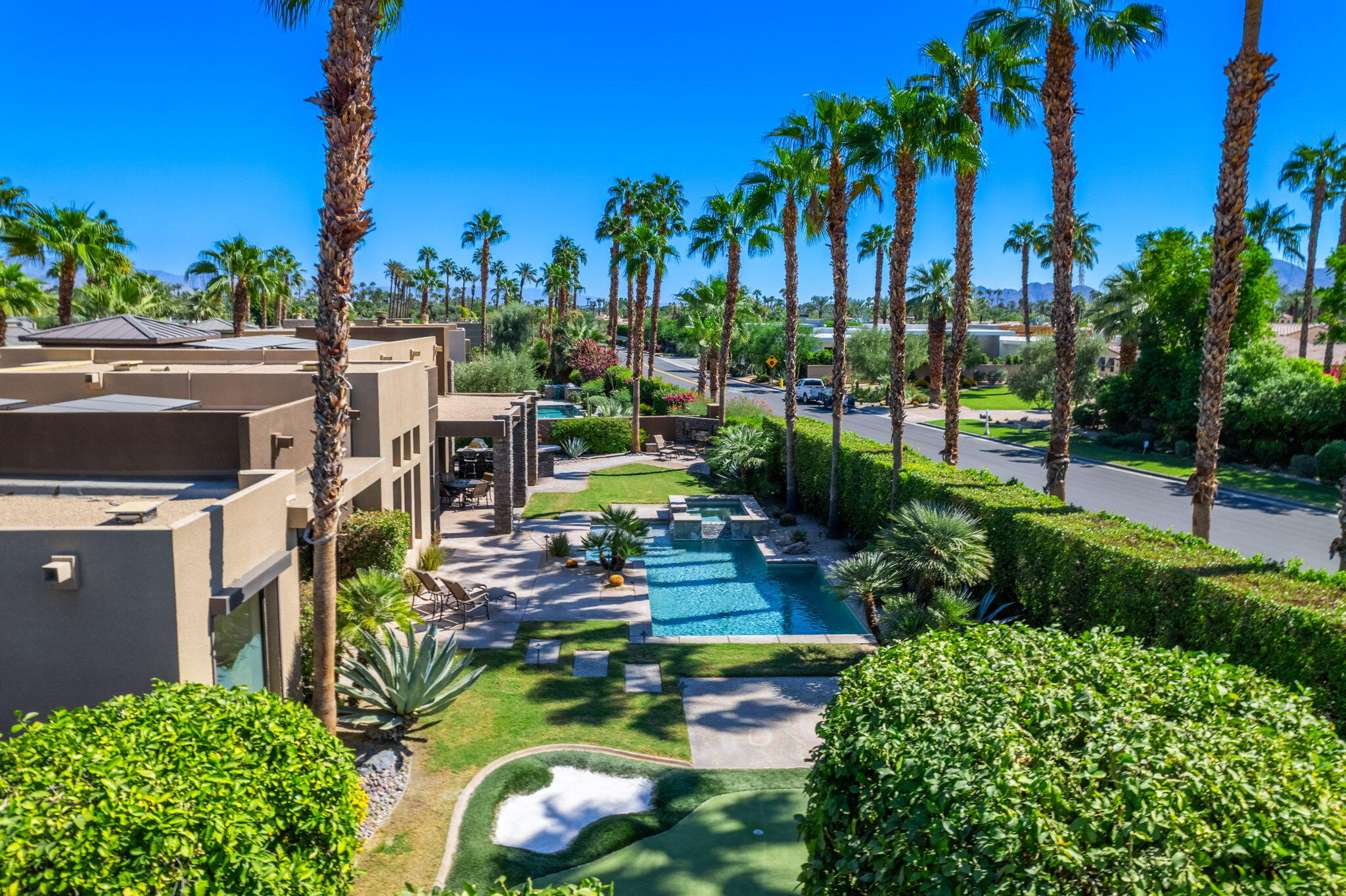 14 Dominion Court Rancho Mirage, CA 92270 - Photo 62 of 65 a view of a swimming pool with a patio