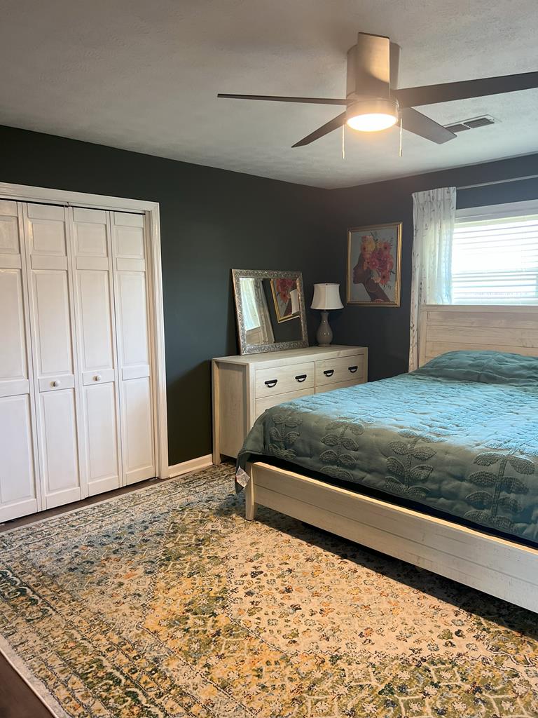 6120 Candlestick Loop Columbus, GA 31909 - Photo 13 of 20 a bedroom with a bed and a dresser