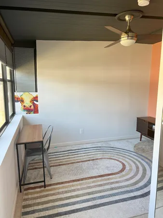 a bed room with a bed and a window