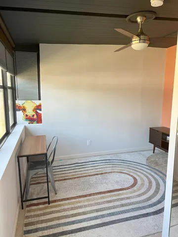 a bed room with a bed and a window