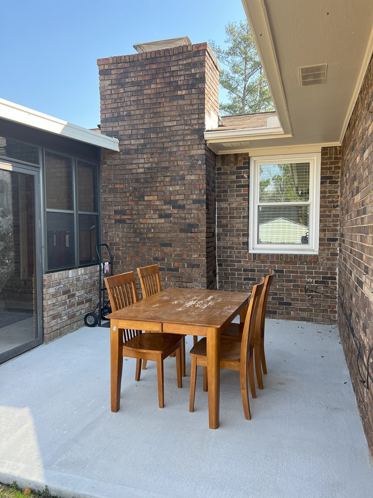 6120 Candlestick Loop Columbus, GA 31909 - Photo 19 of 20 a backyard of a house with table and chairs