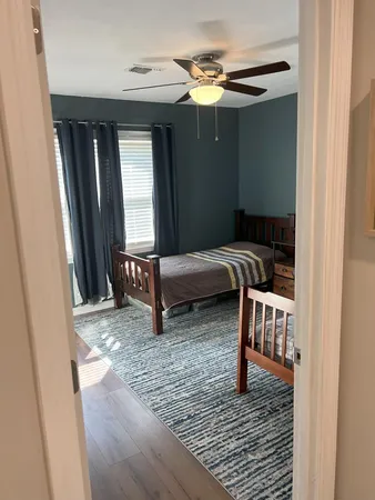 a bedroom with furniture and a window