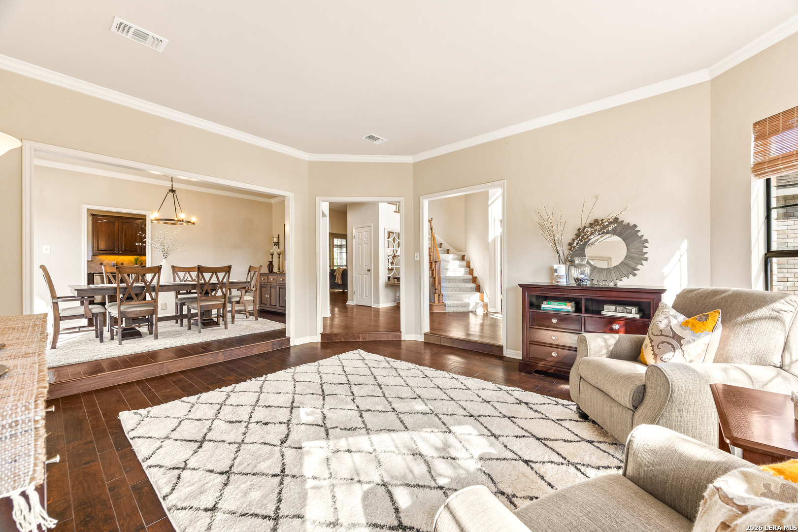 31586 Scarteen Fair Oaks Ranch, TX 78015 - Photo 15 of 67 a living room with furniture a chandelier and a large window