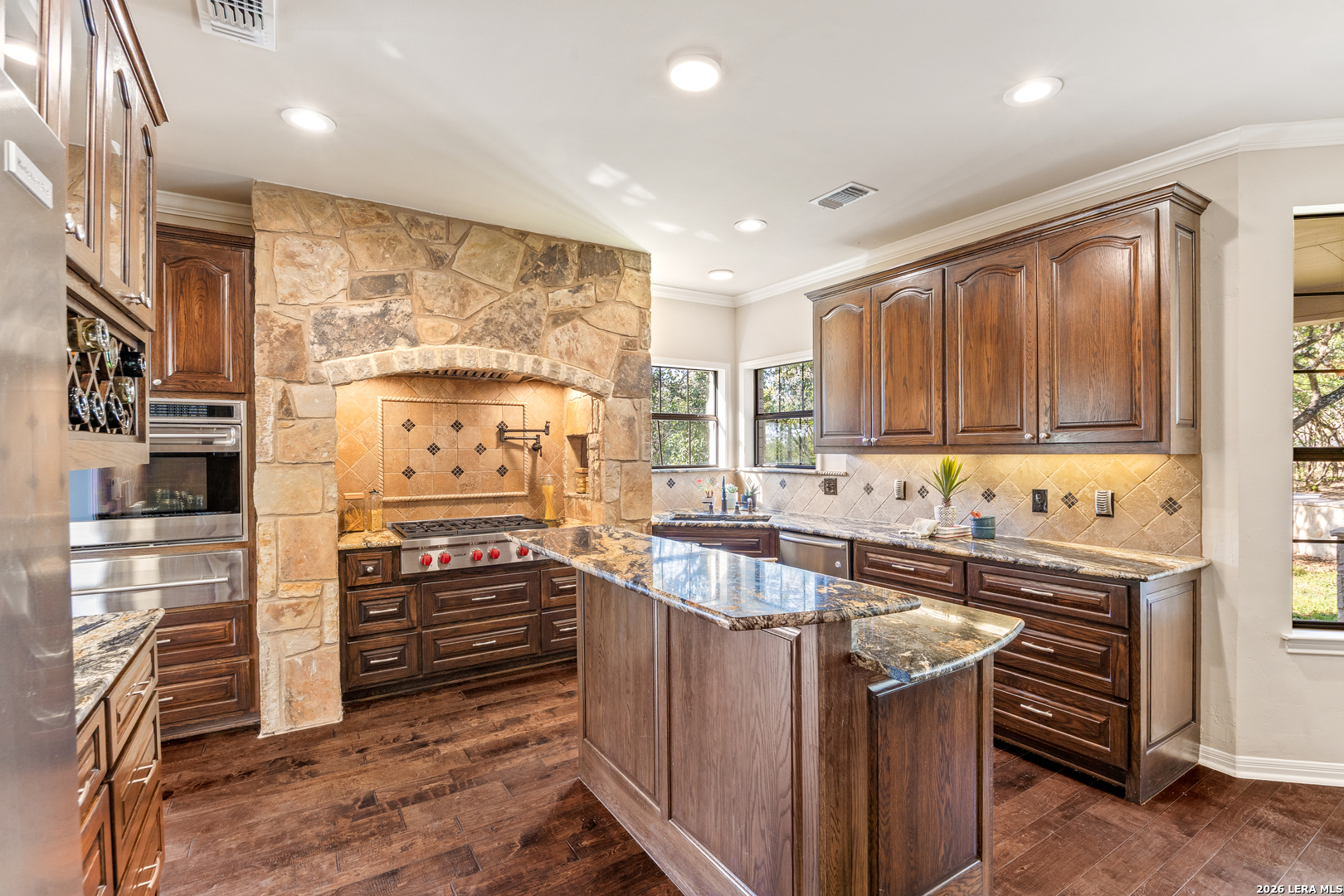 31586 Scarteen Fair Oaks Ranch, TX 78015 - Photo 24 of 67 a kitchen with stainless steel appliances a stove a sink and a refrigerator