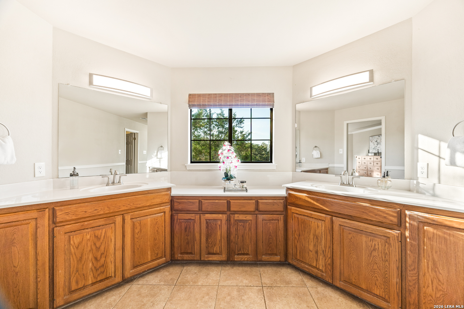 31586 Scarteen Fair Oaks Ranch, TX 78015 - Photo 32 of 67 a large bathroom with a double vanity sink and mirror with
