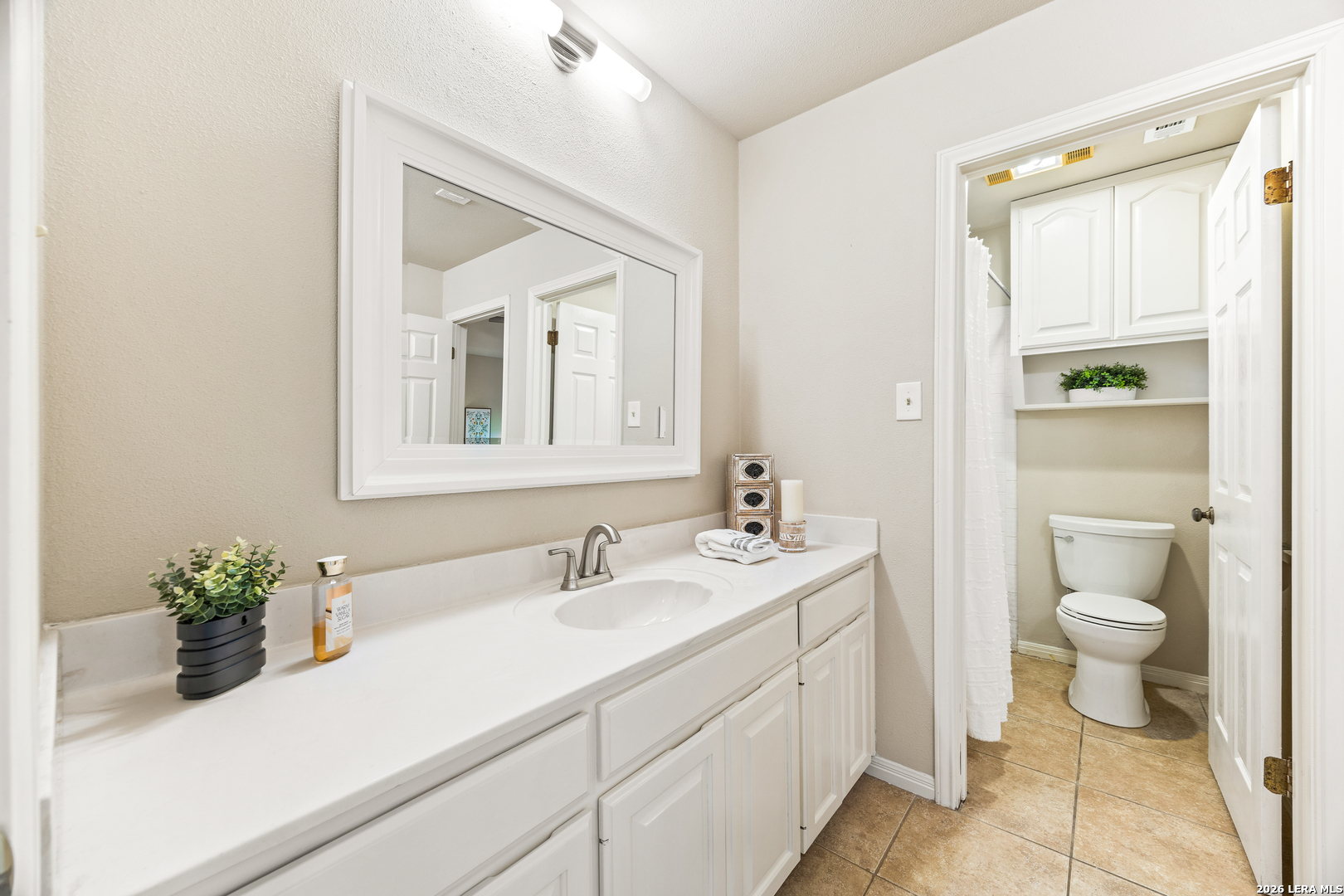 31586 Scarteen Fair Oaks Ranch, TX 78015 - Photo 36 of 67 a bathroom with a sink a toilet and a mirror