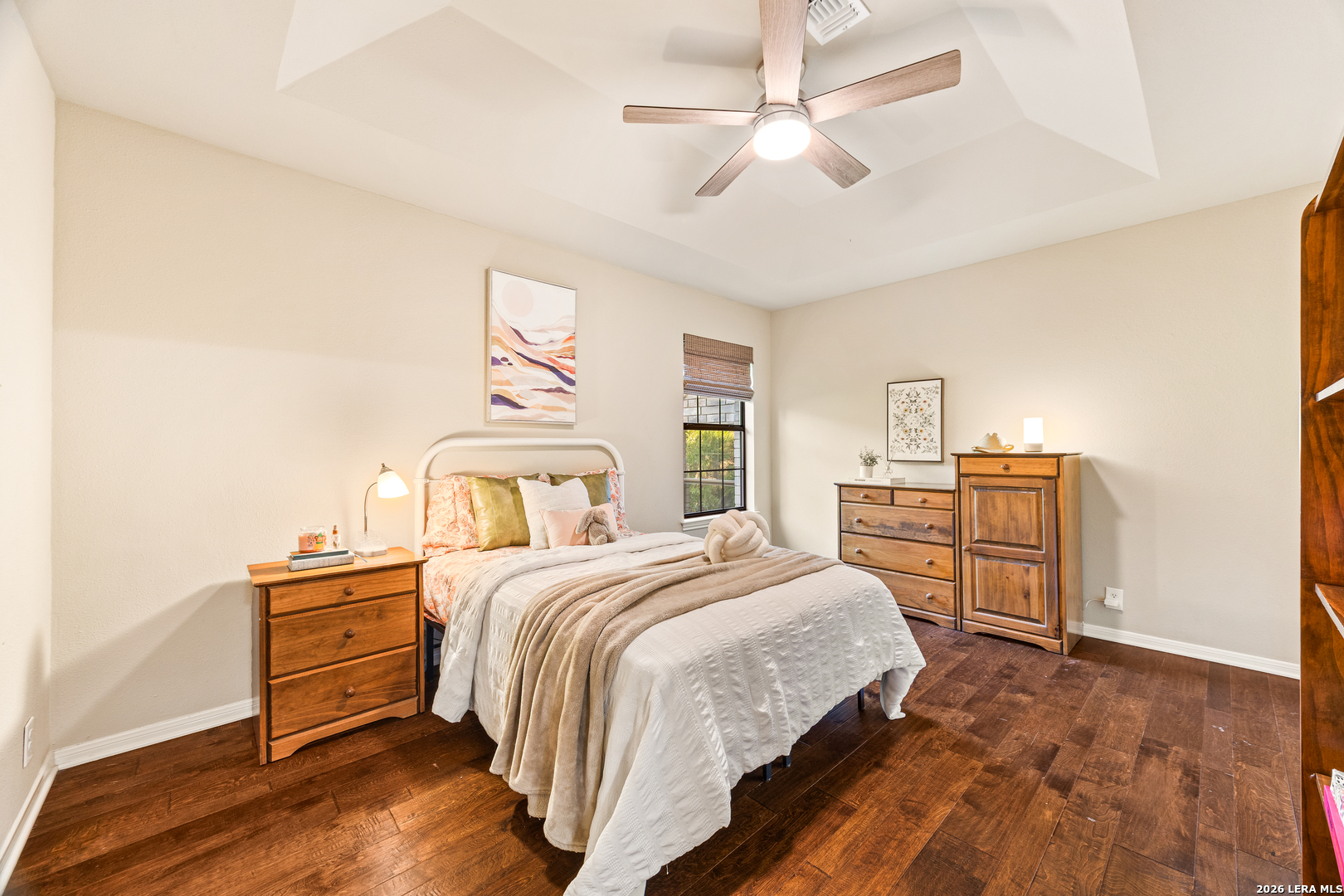 31586 Scarteen Fair Oaks Ranch, TX 78015 - Photo 37 of 67 a bedroom with a bed and a chandelier