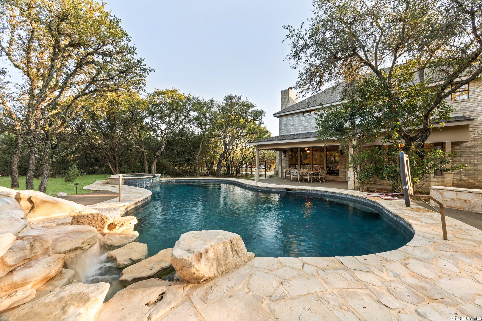 31586 Scarteen Fair Oaks Ranch, TX 78015 - Photo 44 of 67 a view of a swimming pool with a lounge chair