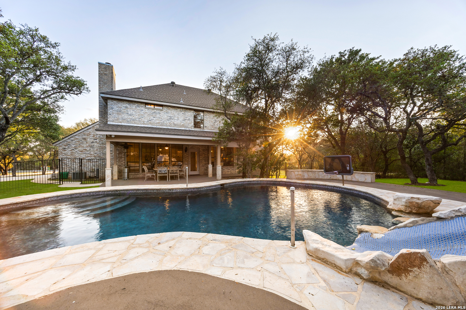 31586 Scarteen Fair Oaks Ranch, TX 78015 - Photo 45 of 67 a view of a house with pool and trees in the background
