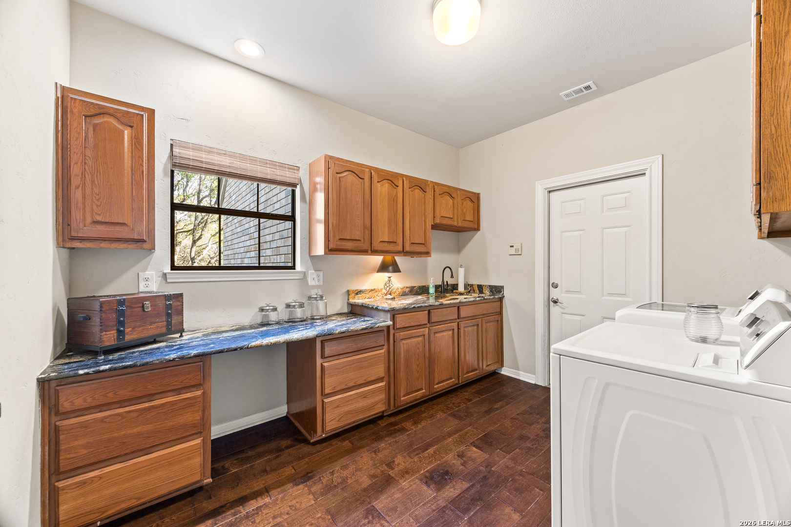 31586 Scarteen Fair Oaks Ranch, TX 78015 - Photo 61 of 67 a kitchen with sink cabinets and window
