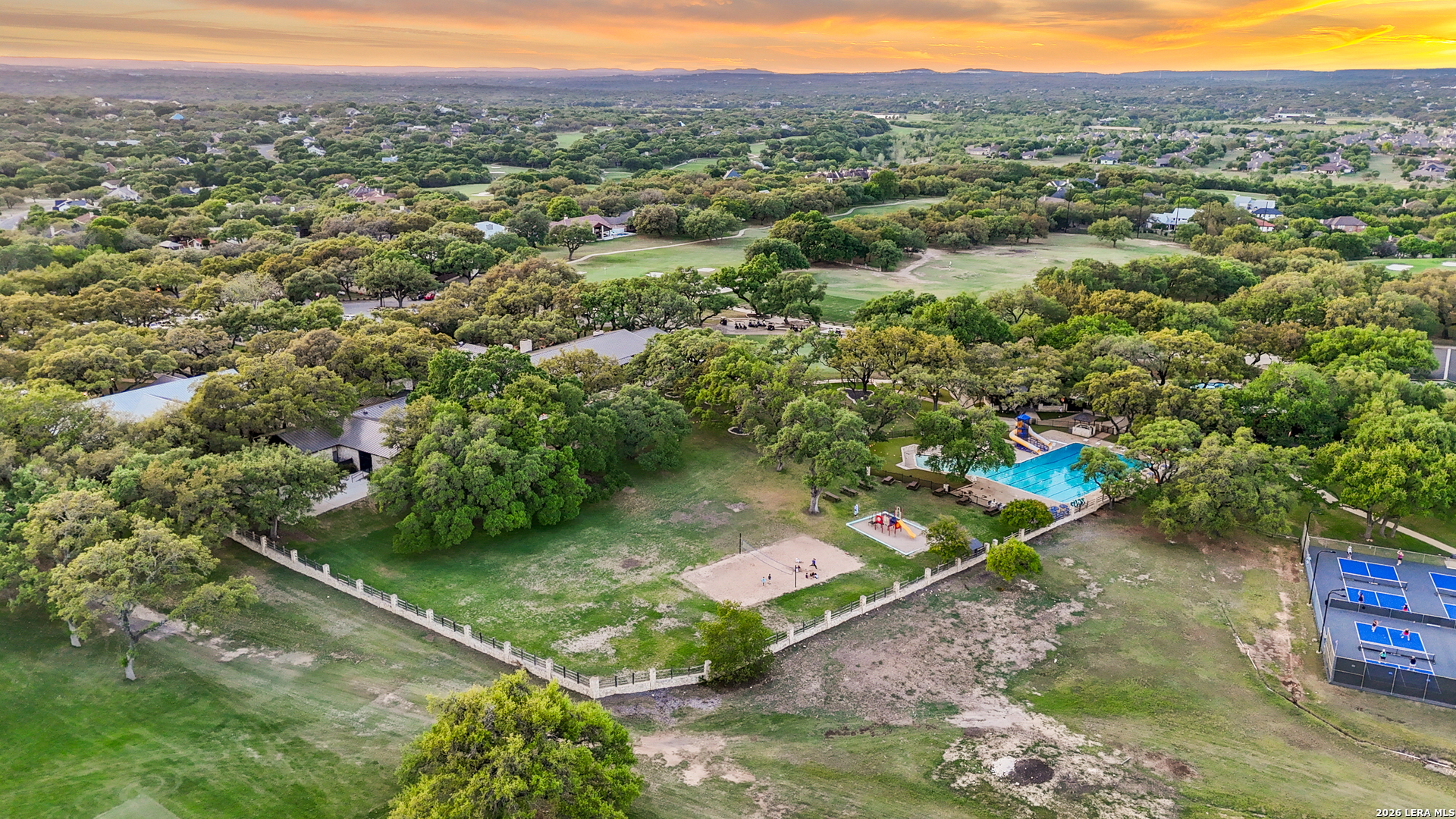 31586 Scarteen Fair Oaks Ranch, TX 78015 - Photo 65 of 67 a view of a green field with lots of potted plants