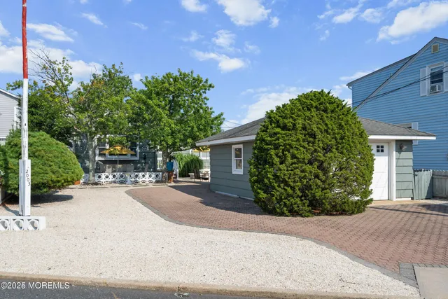 front view of a house with a garden