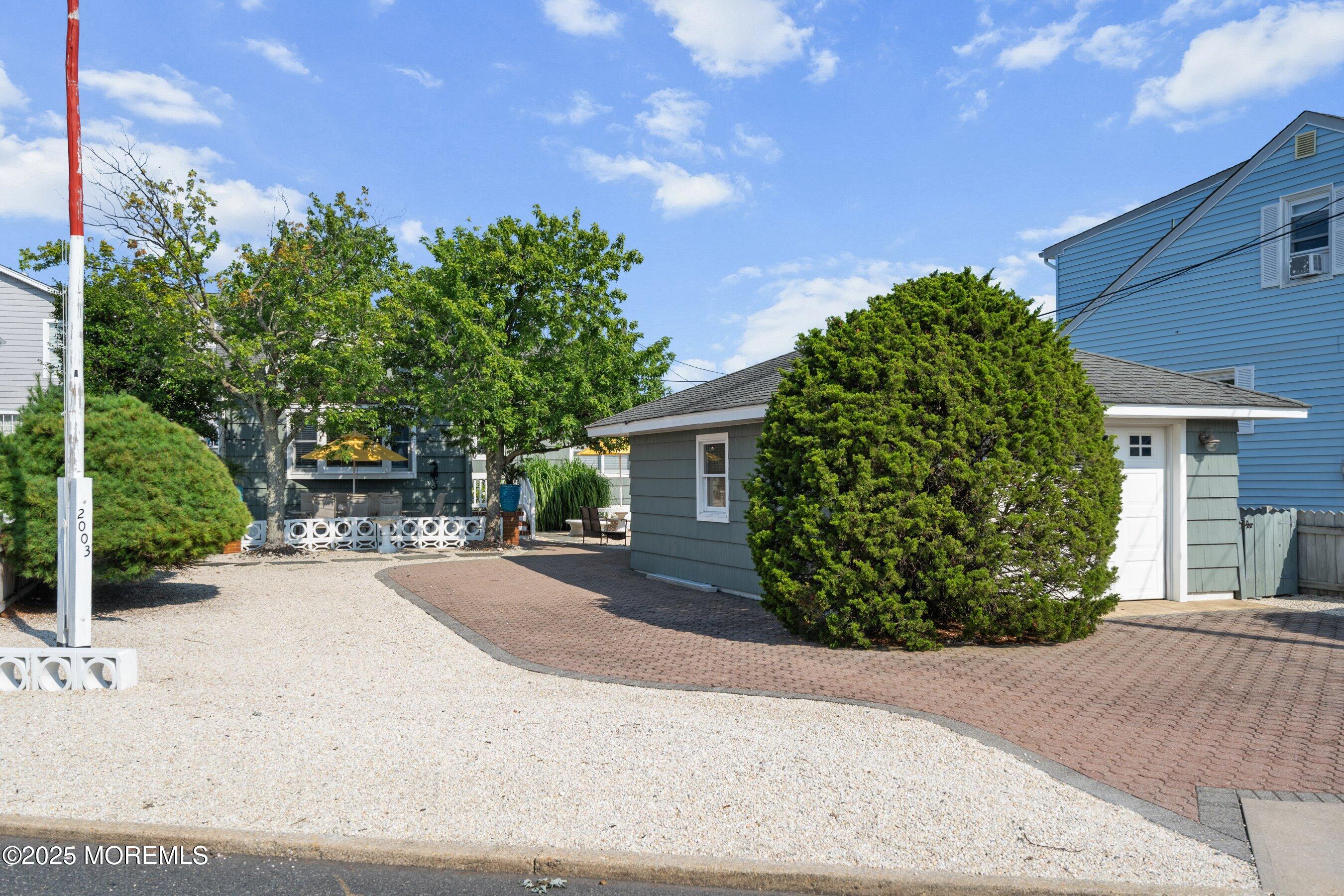 front view of a house with a garden