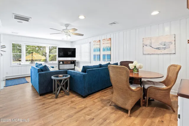 a workspace with furniture and wooden floor