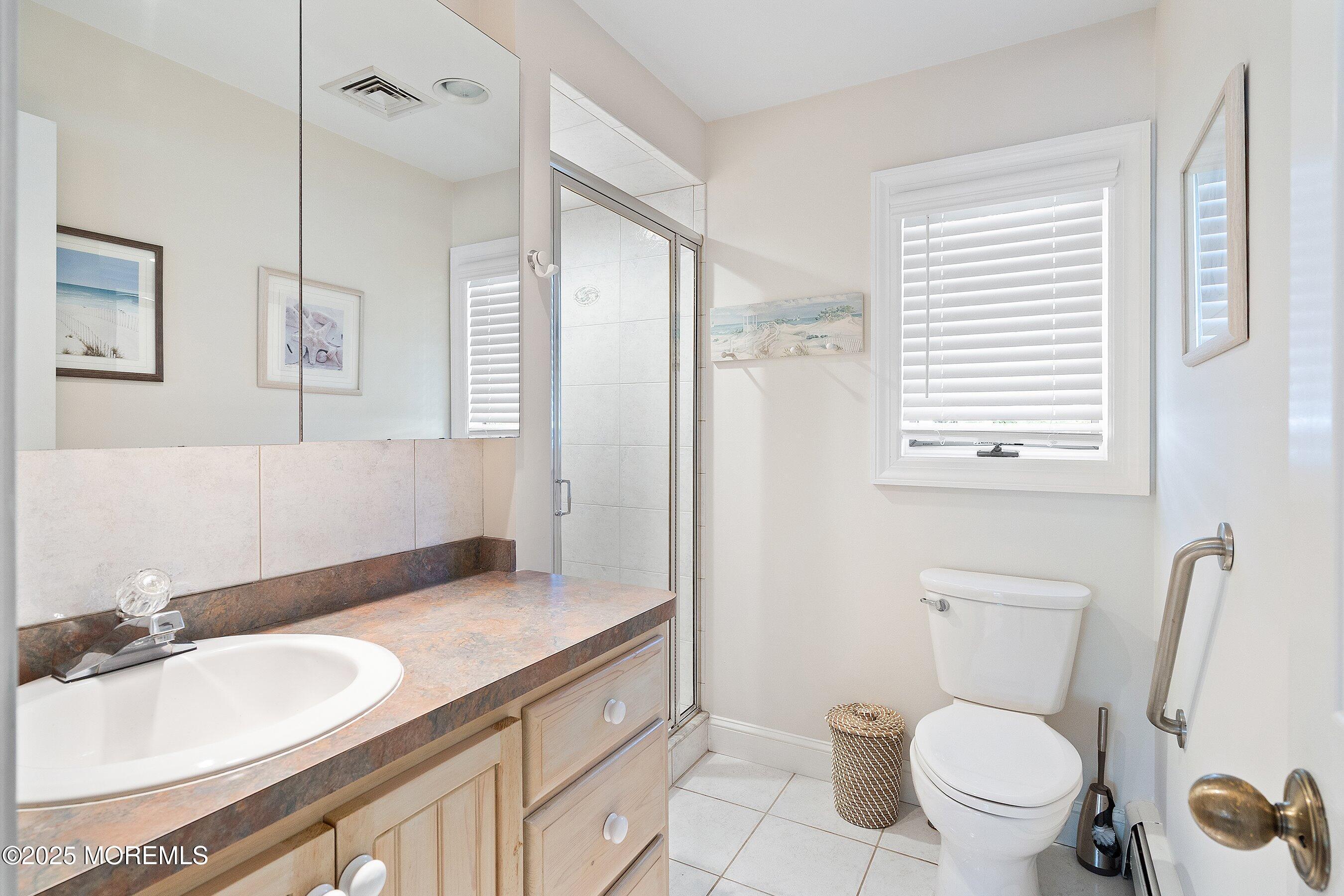 2003 Bay Boulevard Lavallette, NJ 08735 - Photo 21 of 31 a bathroom with a granite countertop sink toilet and shower