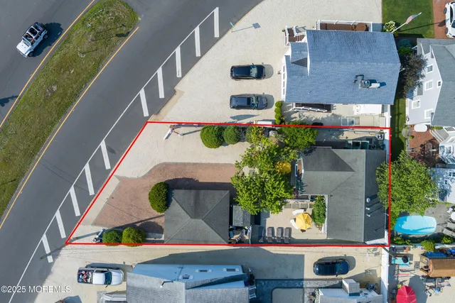 an aerial view of a houses with outdoor space