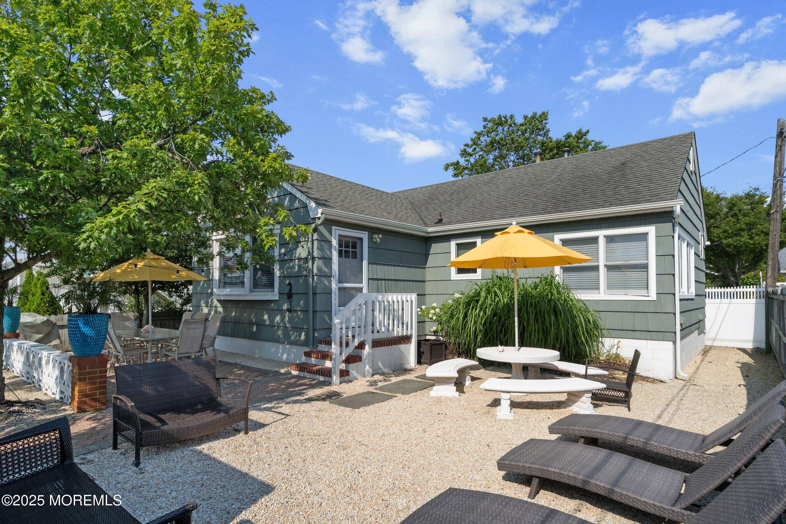2003 Bay Boulevard Lavallette, NJ 08735 - Photo 8 of 31 a backyard of a house with table and chairs