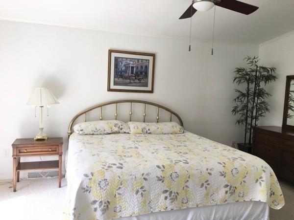 2602 Green Street Middleboro, MA 02346 - Photo 12 of 25 a bedroom with a bed and a table in it