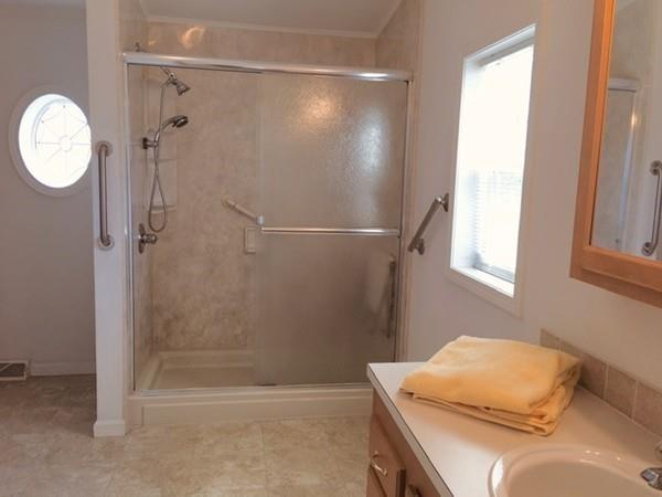 2602 Green Street Middleboro, MA 02346 - Photo 13 of 25 a bathroom with a tub a sink and a shower