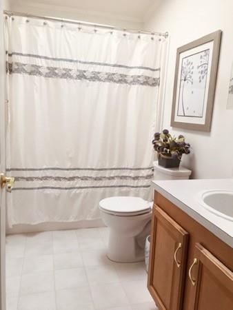 2602 Green Street Middleboro, MA 02346 - Photo 15 of 25 a bathroom with a granite countertop sink mirror vanity and toilet
