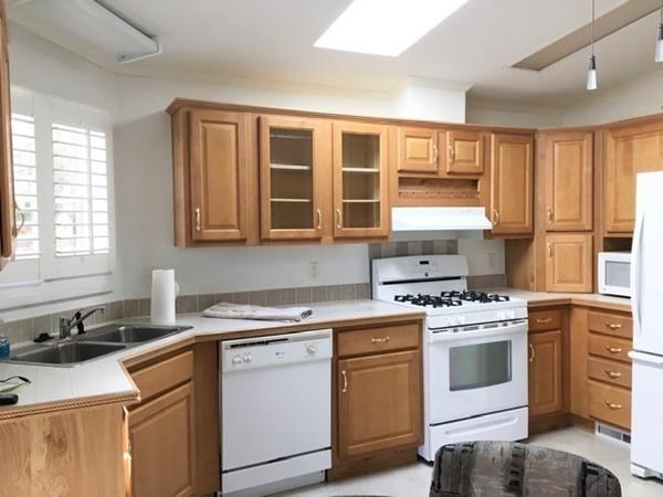 2602 Green Street Middleboro, MA 02346 - Photo 3 of 25 a kitchen with cabinets appliances a sink and a window