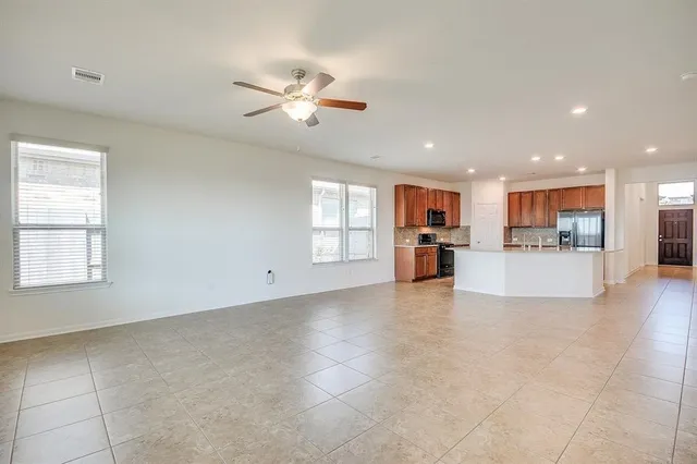 a view of a kitchen with a sink and a window