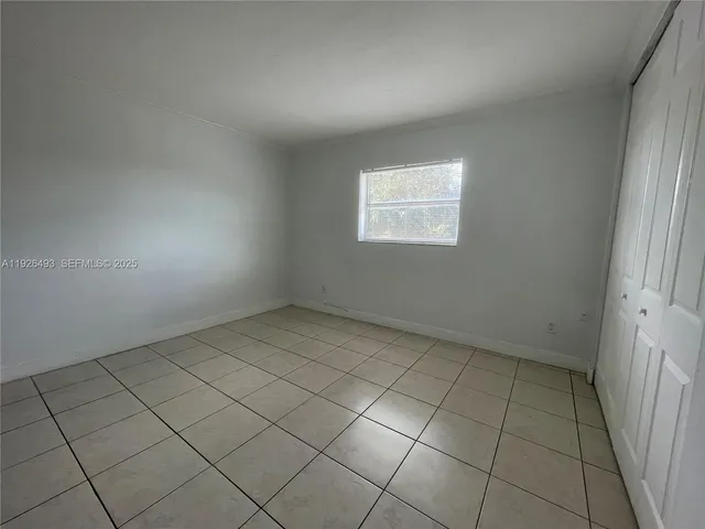 a bathroom with a granite countertop toilet a sink and bathtub