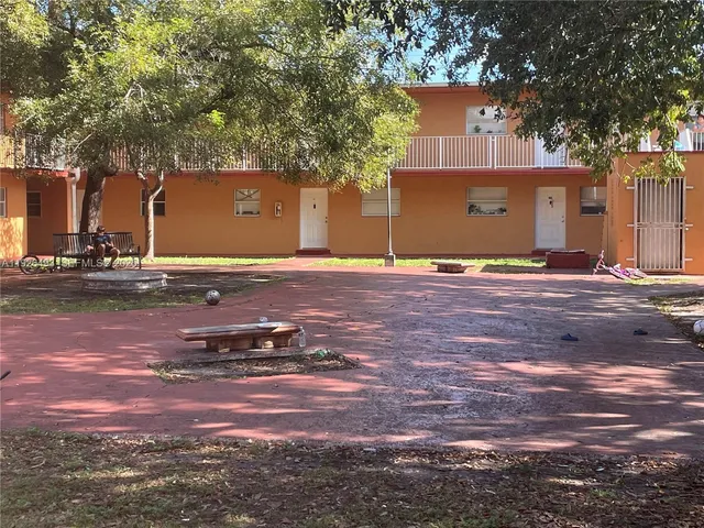 a view of a house with basketball court