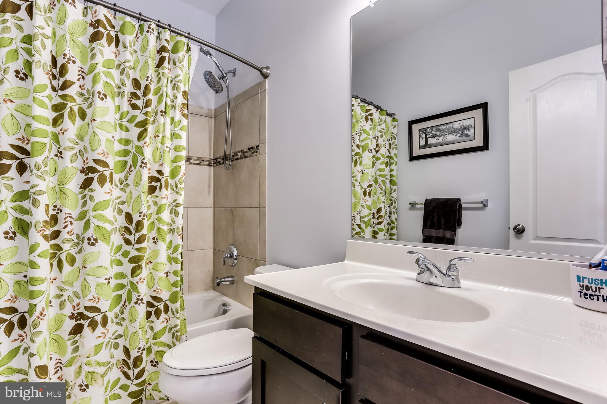 9362 Rock Ripple Lane Laurel, MD 20723 - Photo 21 of 34 Full hall bath with custom tile in the shower