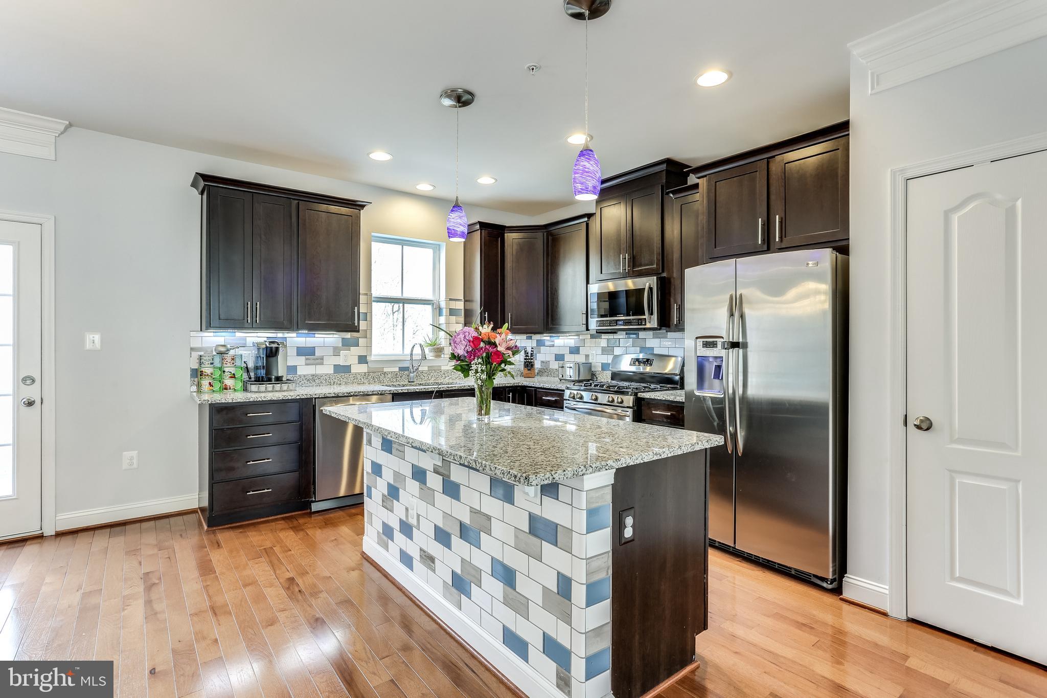 Granite counter tops and large custom tiled island
