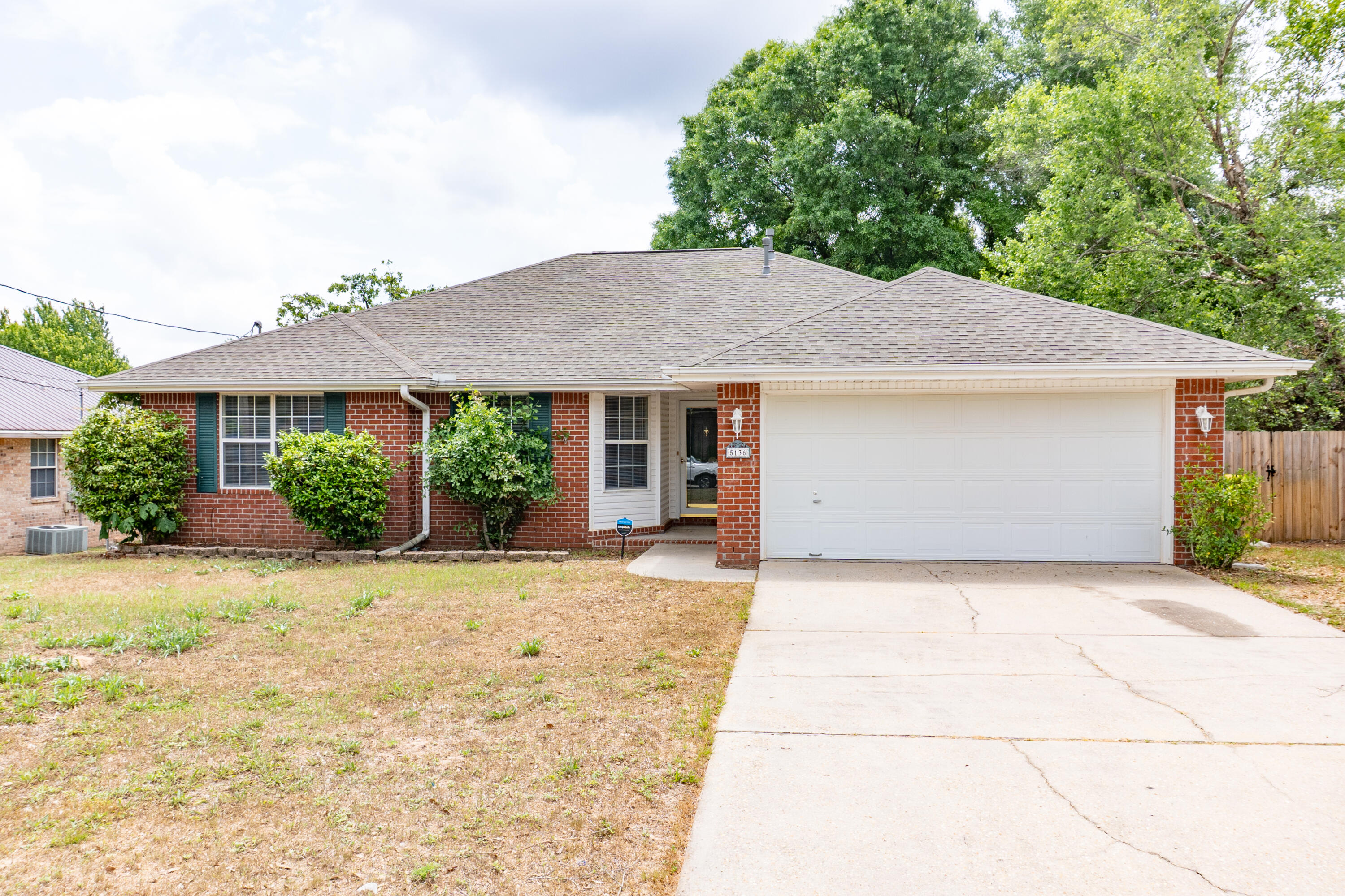5136 Whitehurst Lane Crestview, FL 32536 - Photo 1 of 24 a front view of a house with garden