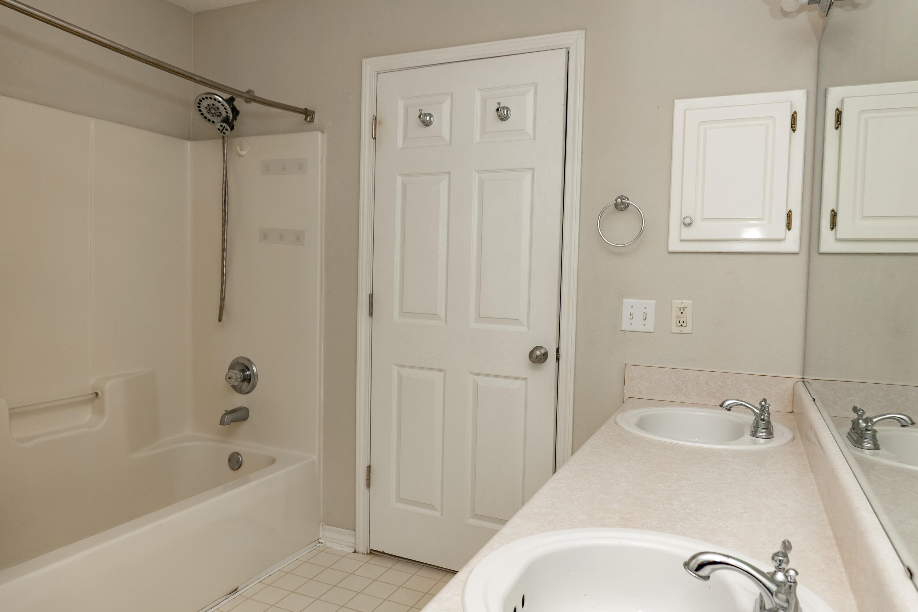 5136 Whitehurst Lane Crestview, FL 32536 - Photo 13 of 24 a bathroom with a tub shower sink and vanity