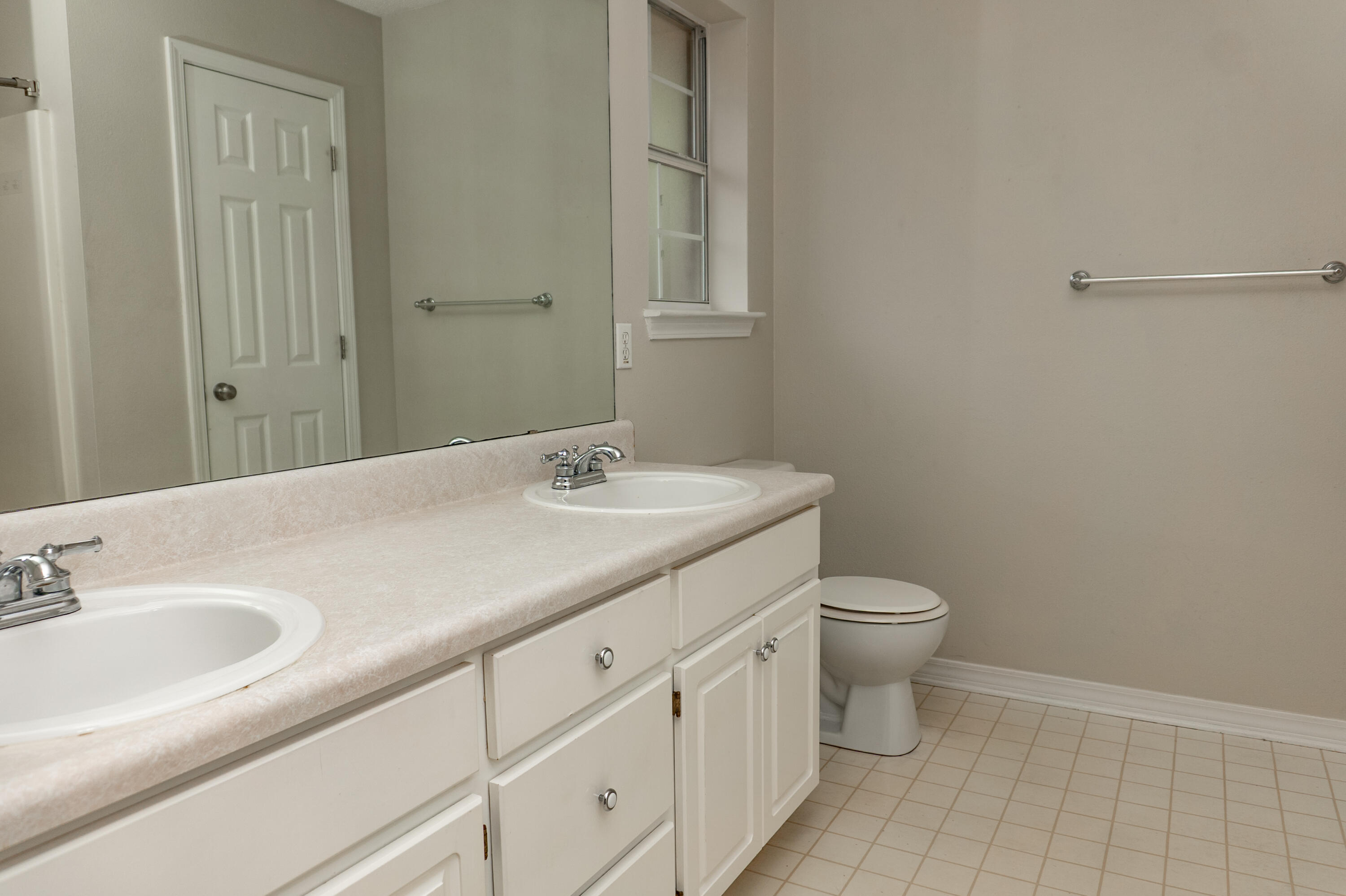 5136 Whitehurst Lane Crestview, FL 32536 - Photo 14 of 24 a bathroom with a granite countertop sink and a toilet