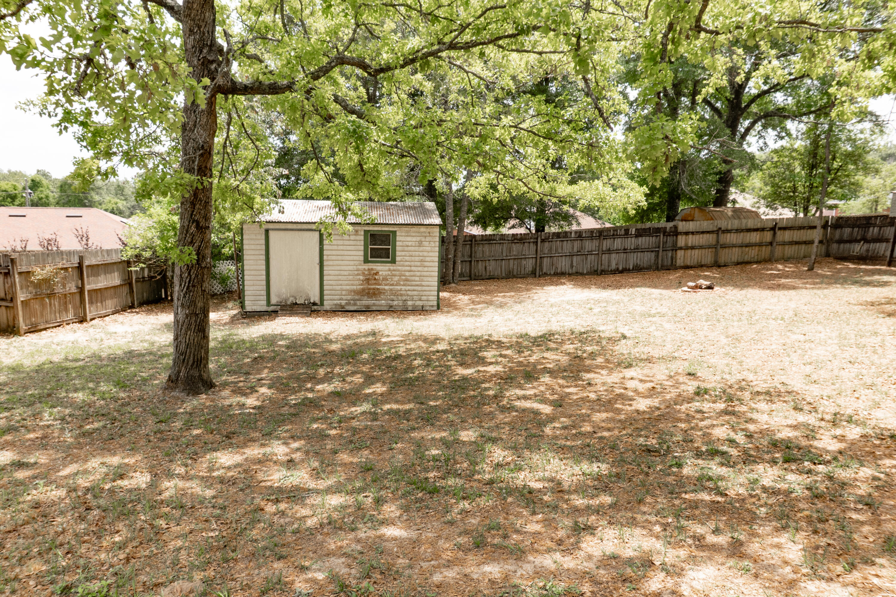 5136 Whitehurst Lane Crestview, FL 32536 - Photo 22 of 24 a backyard of a house with lots of green space