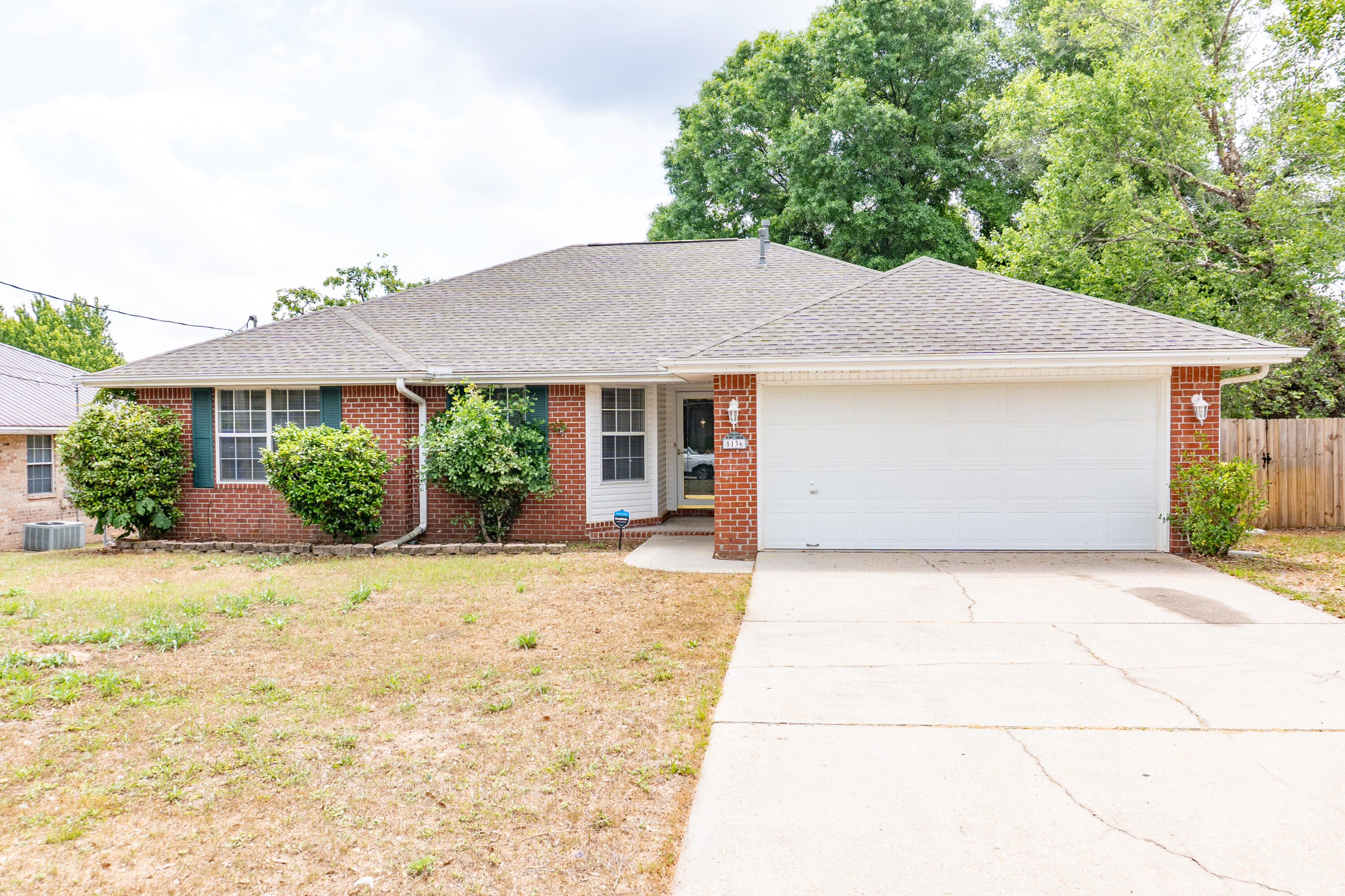 5136 Whitehurst Lane Crestview, FL 32536 - Photo 23 of 24 a front view of a house with garden