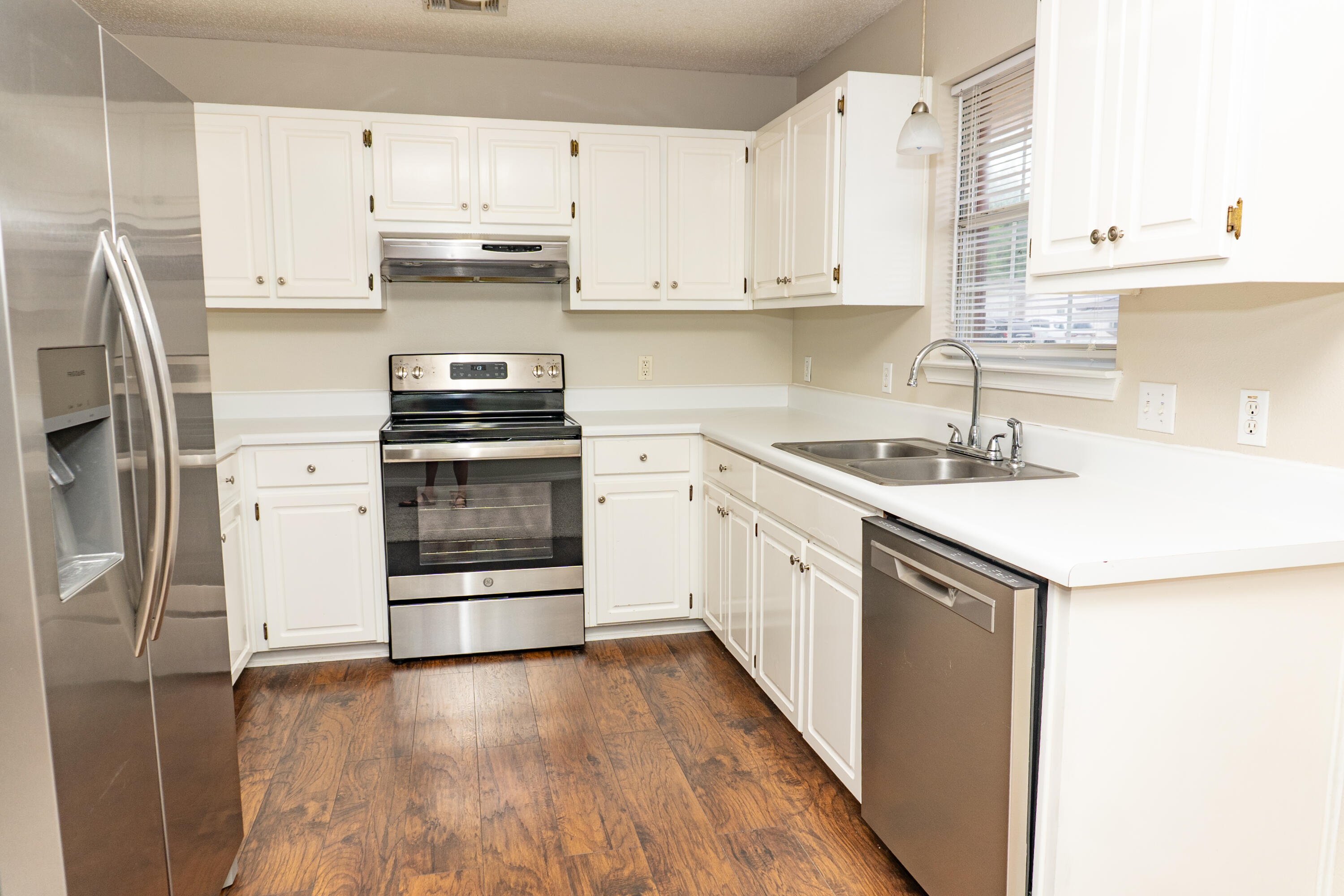 5136 Whitehurst Lane Crestview, FL 32536 - Photo 3 of 24 a kitchen with a sink a stove and cabinets