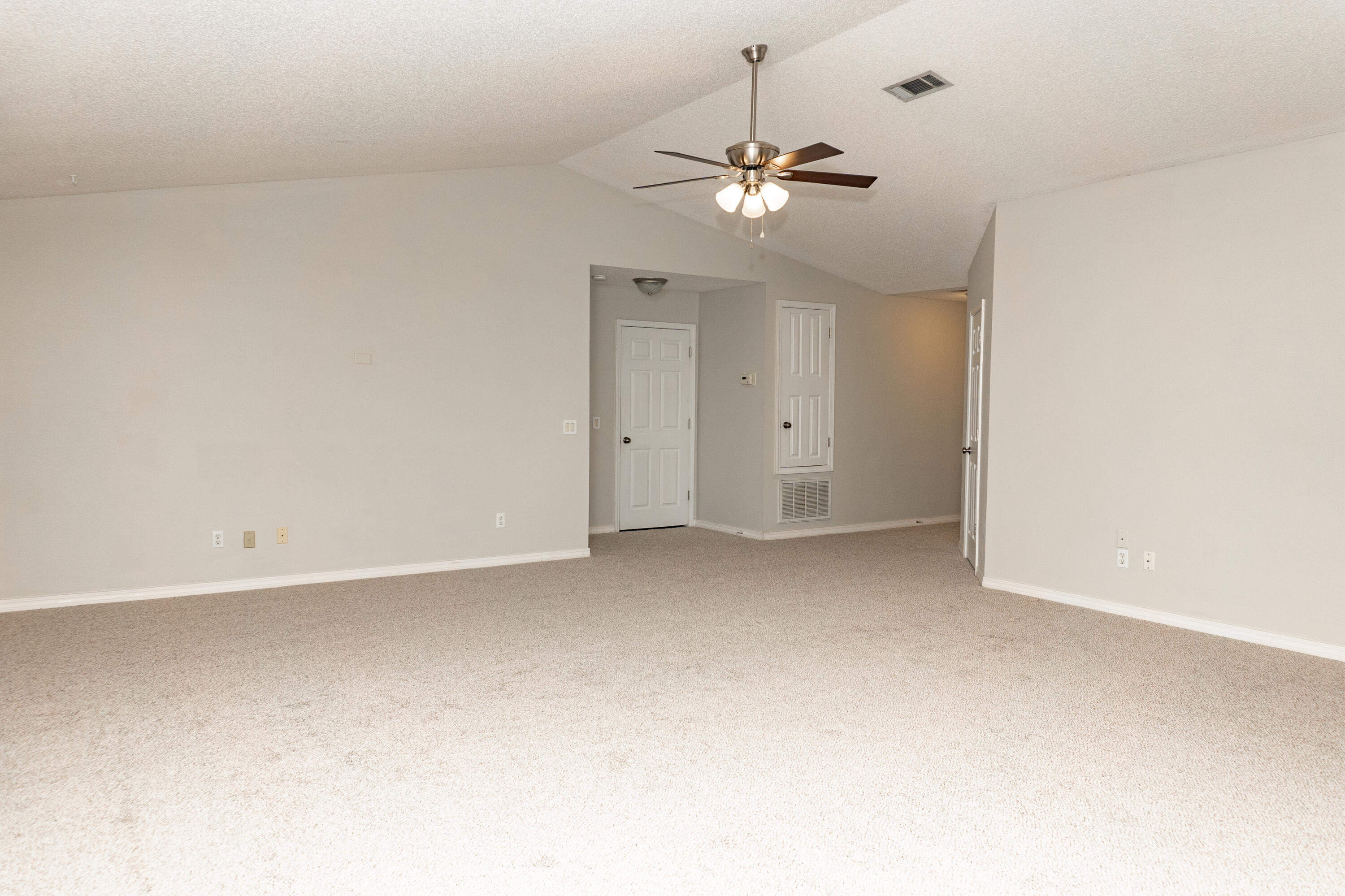 5136 Whitehurst Lane Crestview, FL 32536 - Photo 6 of 24 an empty room with a chandelier fan