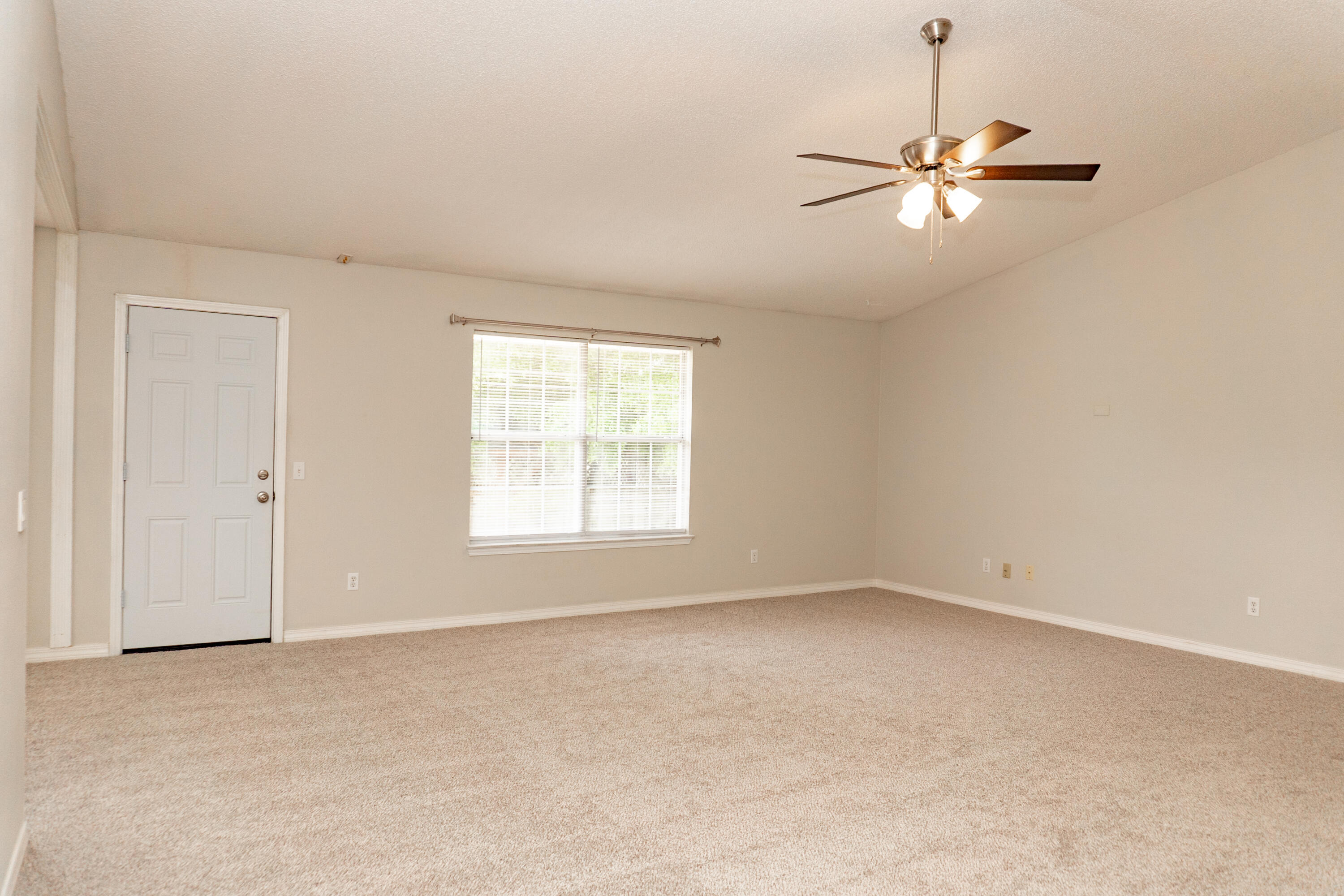 5136 Whitehurst Lane Crestview, FL 32536 - Photo 7 of 24 an empty room with a window and a fan
