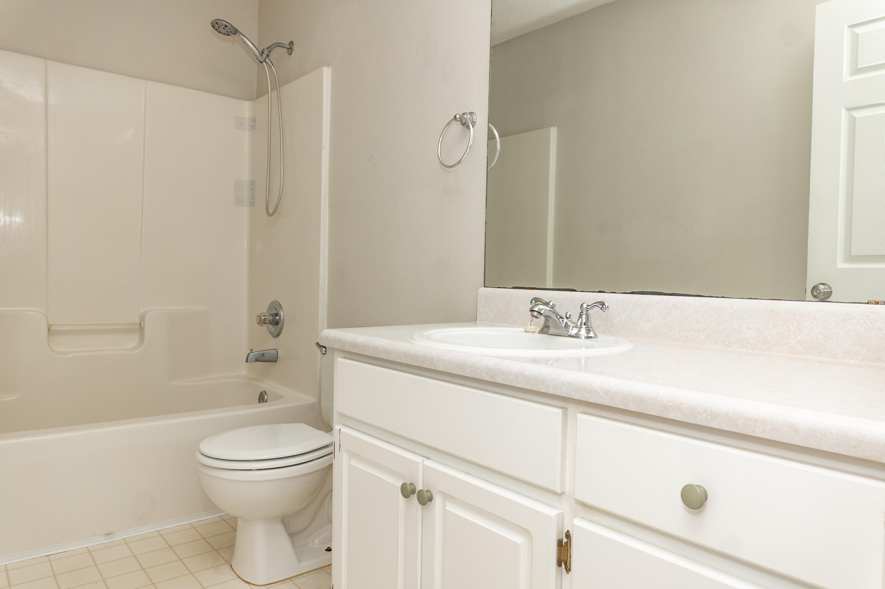 5136 Whitehurst Lane Crestview, FL 32536 - Photo 8 of 24 a bathroom with a granite countertop sink a toilet and shower