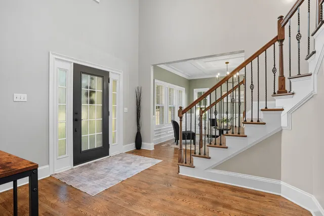 a bathroom with a sink a mirror a vanity and shower
