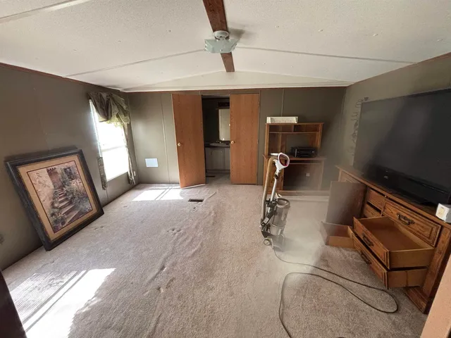 a room with gym equipment and a window