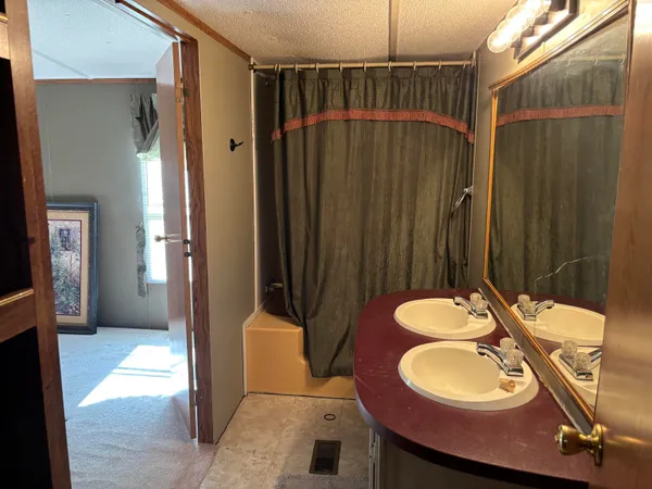 a view of an empty room and a walk in closet