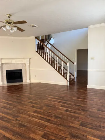 a view of livingroom and kitchen with wooden floor